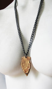 Abstract  bronze arrowhead on a stainless chain - Dennis Higgins Jewelry